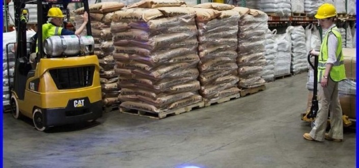 Workers using Forklifts for lifting goods in warehouse,OH