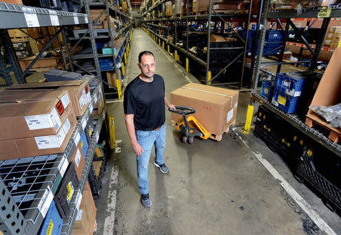 man pulling pallet jack