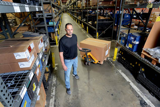 man pulling pallet jack