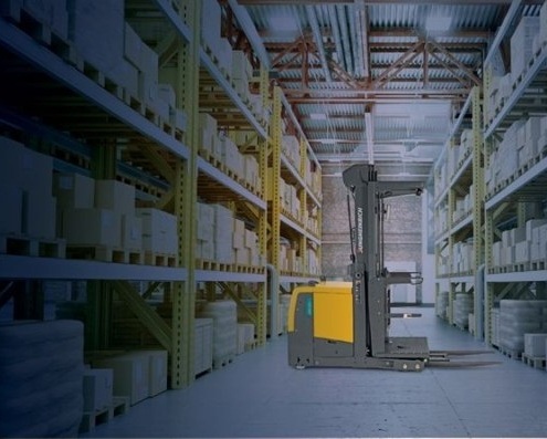 Forklift in middle of aisle for order picking by Miami Industrial Trucks